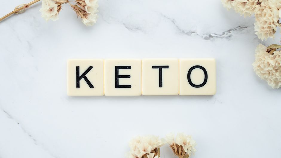Keto diet coaching concept with scrabble tiles spelling keto