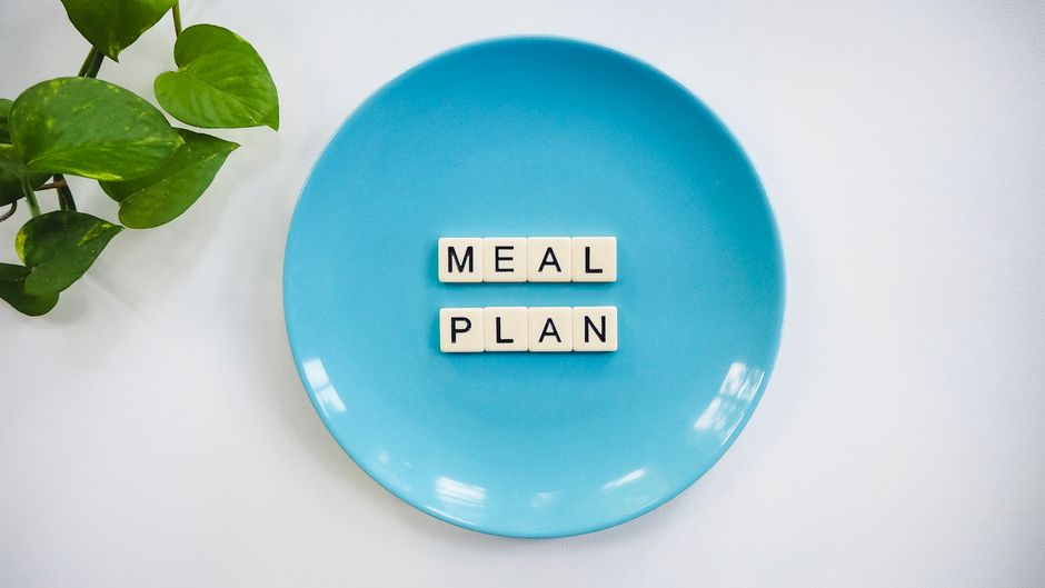 Meal plan blocks on a blue ceramic plate
